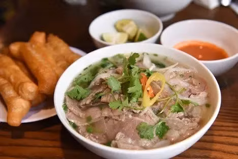 Hanoi's pho bo (noodle soup with beef) is named the best Hanoi street food dishes to sample