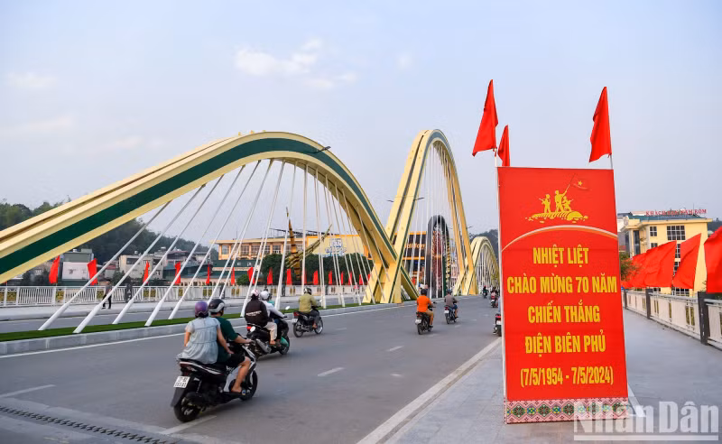 Thanh Binh Bridge, a project to celebrate Dien Bien Phu Victory, is decorated with red flags.