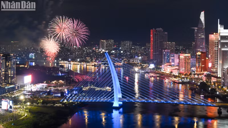 Reunification anniversary fireworks dazzle night sky above Saigon River
