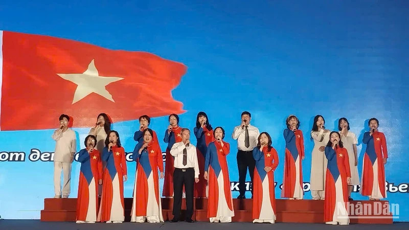 Le Duc Man (front row, centre) and his students in a performance at the programme 
