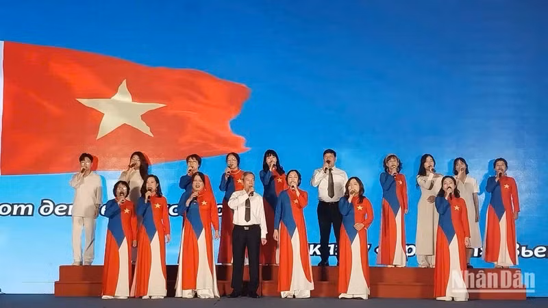 Le Duc Man (front row, centre) and his students in a performance at the programme 