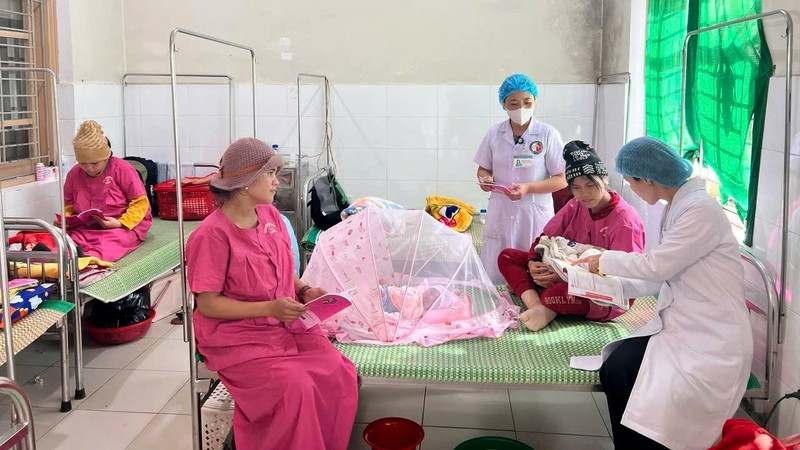 Health workers instruct mothers with newborns at the Centre for Disease Control in Hue City.