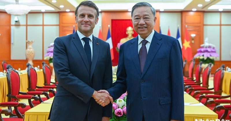 Vietnamese Party General Secretary To Lam (R) and French President Emmanuel Macron