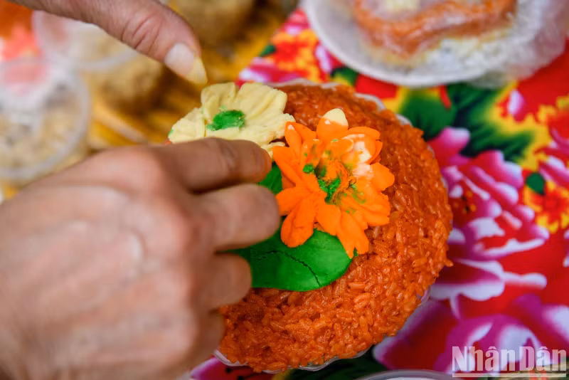Careful hands of artisans with a traditional plate of sticky rice.