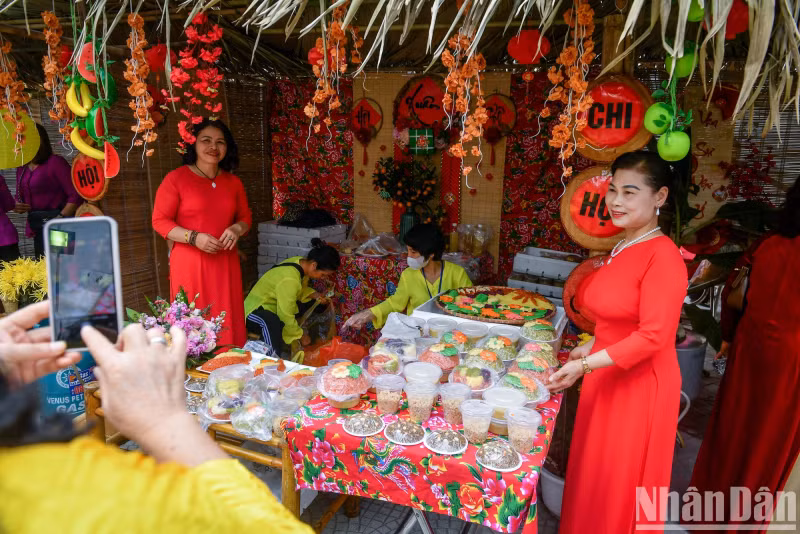 Tourists capture moments at the traditional festival of Phu Thuong Village.