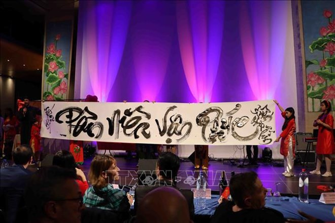 At the "Spring of Love" event (Photo: VNA)