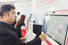 Smart kiosks are making it easier for citizens to complete administrative procedures. Photo: NAM NGUYEN