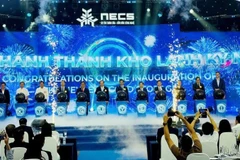 Delegates perform the inauguration ceremony of the New Era Cold Storage facility in Tay Ninh.