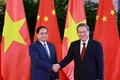 Prime Minister Pham Minh Chinh (left) and Chinese Premier Li Qiang at their meeting in Tianjin on June 24 (Photo: VNA)