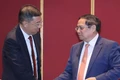 Prime Minister Pham Minh Chinh (right) meets Chairman of the Bank of China (BOC) Ge Haijiao on June 24, 2025. (Photo: VNA)