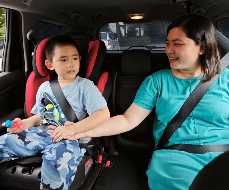 Children must be seated in the rear of a car and child safety restraints (CRS) must be used. 