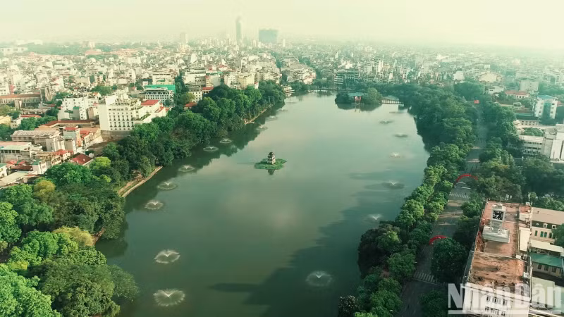 Thap rua (Turtle Tower) is located in the middle of a green area in the city.