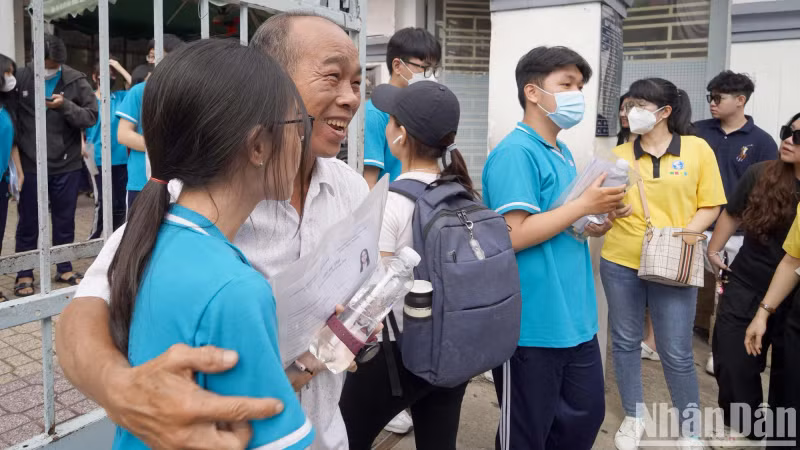 A candidate’s father expresses his joy after 120 minutes of waiting for his daughter to take the first test. A candidate’s father expresses his joy after 120 minutes of waiting for his daughter to take the first test.