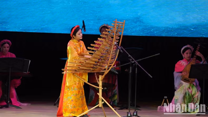 Artists from the Vietnam National Academy of Music perform at the event.