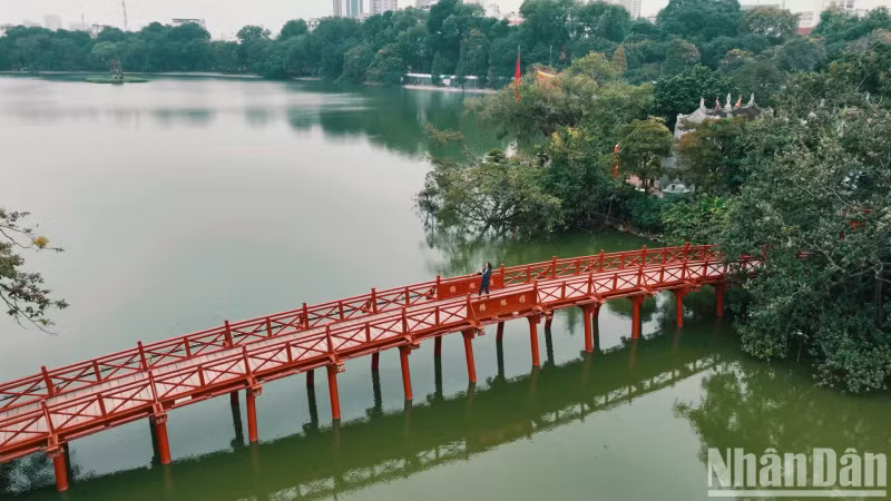The Huc Bridge is a highlight among the quiet green patches.