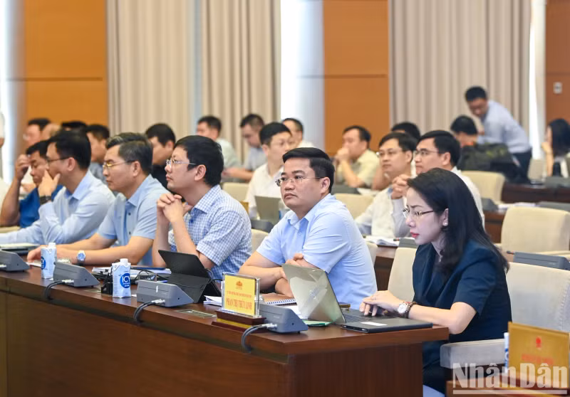 The delegates attend the session.