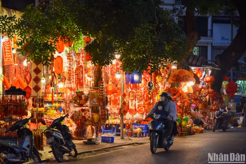 The street is flooded with red and yellow colours, which symbolise luck and prosperity, signalling the Lunar New Year.