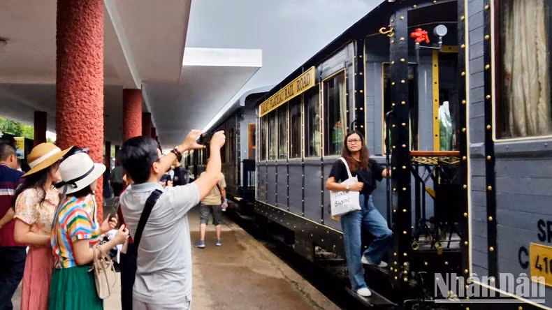 Tourists take photos at the Da Lat Railway Station.