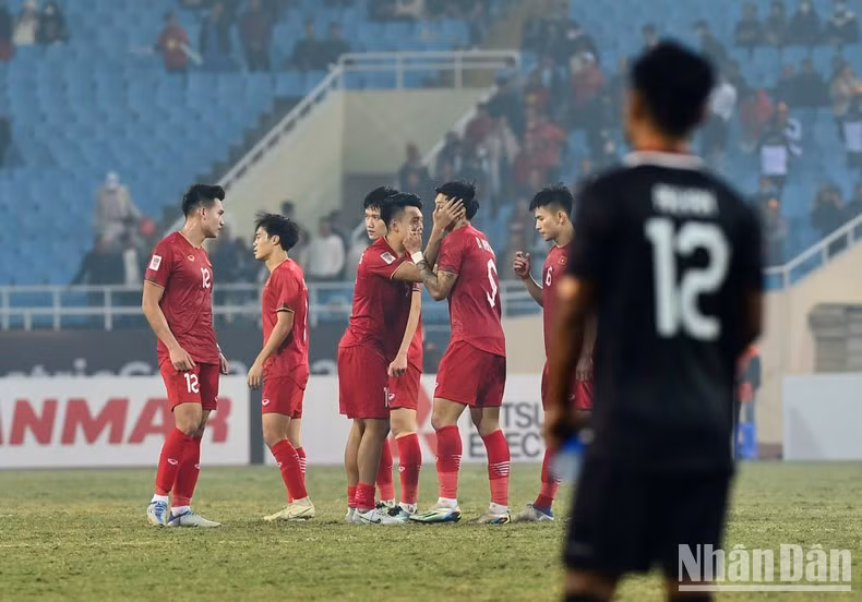 Vietnamese players rejoice after the referee blew the whistle to end the semi-final second leg.