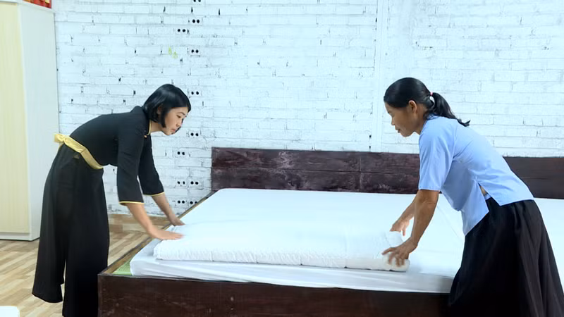 The staff of Ban Chuong Homestay prepare to welcome tourists. The staff of Ban Chuong Homestay prepare to welcome tourists.