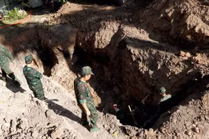Search and recovery operations at the second burial site
