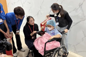 Gifts presented to a child patient ahead of Lunar New Year Festival (Tet)