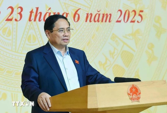 Prime Minister Pham Minh Chinh speaks at the national teleconference. (Photo: VNA) 230625-tt-chong-hang-gia.jpg