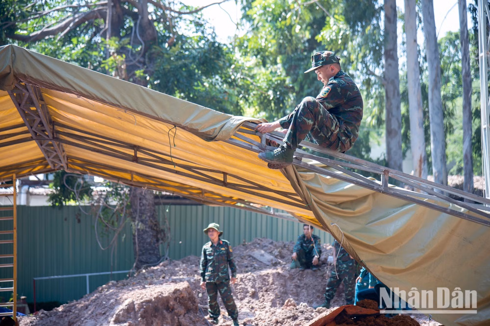 When sudden heavy rain falls, the teams carefully cover excavation sites to protect areas suspected of containing human remains.