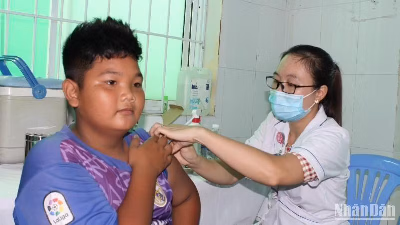 A boy is vaccinated against COVID-19 in Ho Chi Minh City.