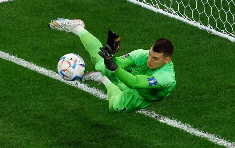 Croatia's Dominik Livakovic saves a penalty taken by Brazil's Rodrygo. REUTERS/Lee Smith