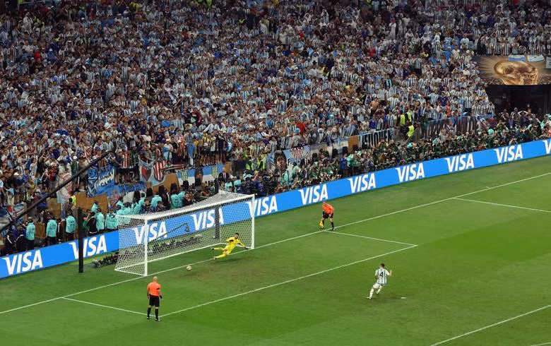Argentina's Gonzalo Montiel scores a penalty during the penalty shootout. REUTERS/Paul Childs