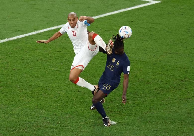 Tunisia's Wahbi Khazri in action with France's Eduardo Camavinga. REUTERS/Marko Djurica
