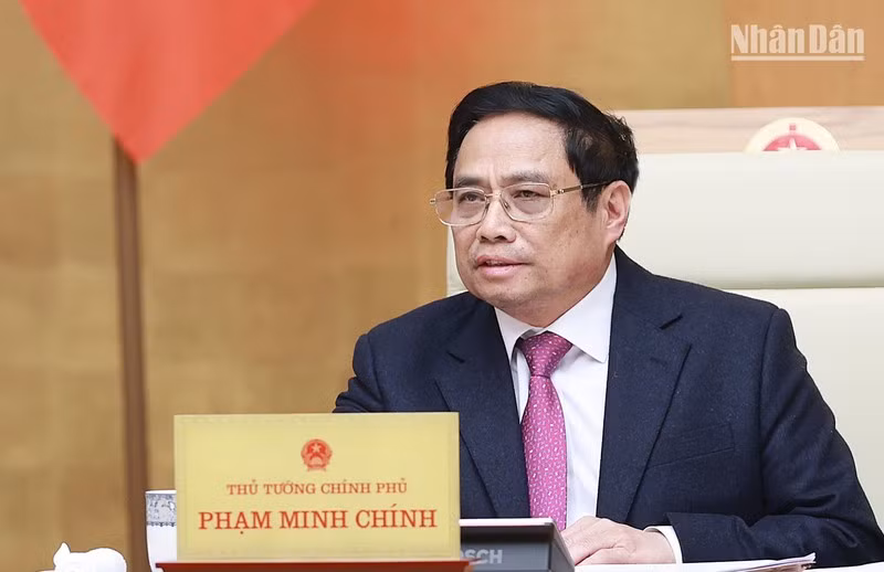 Prime Minister Pham Minh Chinh speaks at the meeting. (Photo: Tran Hai)