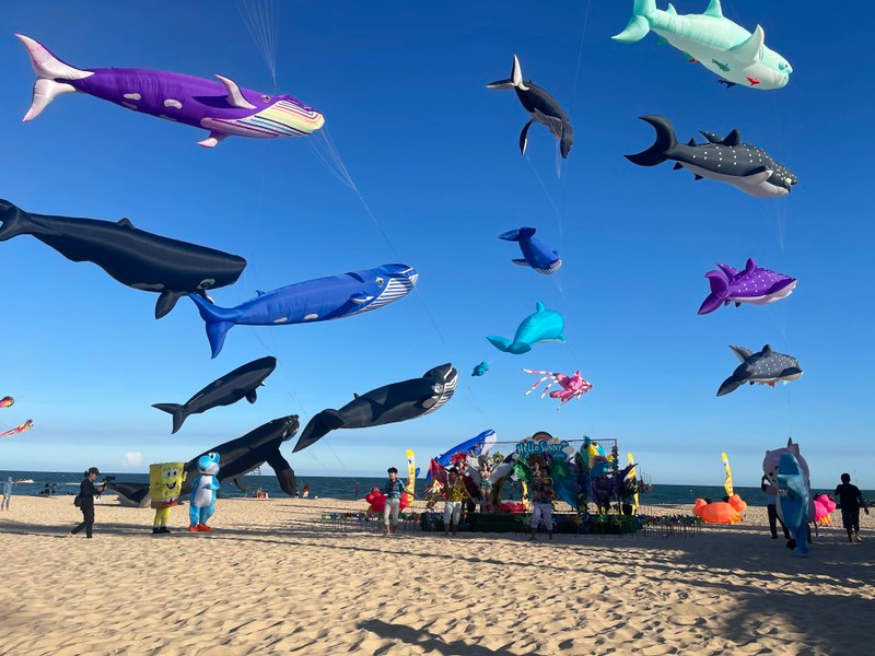 Giant kites shaped like sea creatures are flown at the festival.