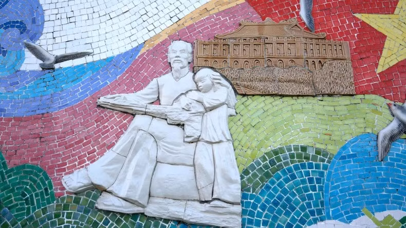 A ceramic mural of Uncle Ho with children. A ceramic mural of Uncle Ho with children.
