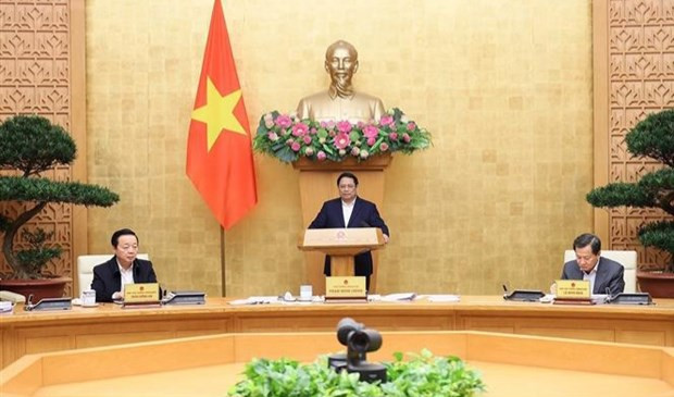 Prime Minister Pham Minh Chinh speaks at the meeting. (Photo: VNA)