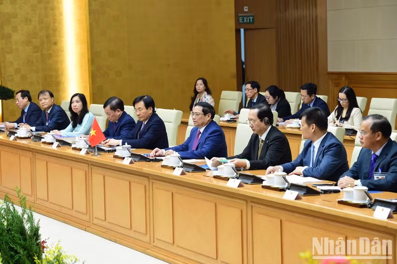 Prime Minister Pham Minh Chinh and members of the Vietnamese government at the talks.