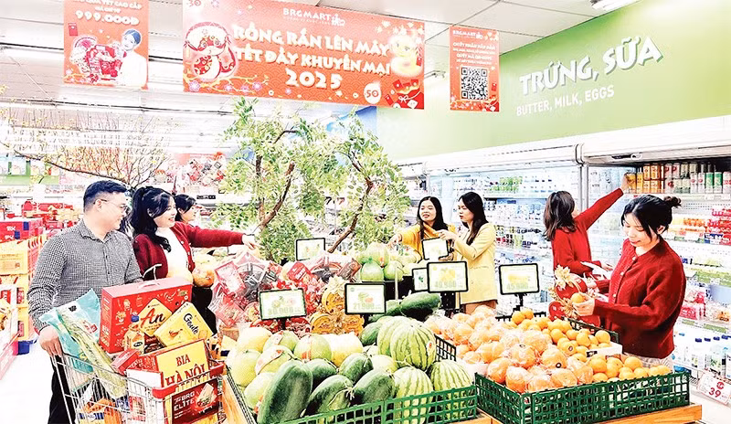 Consumers shop for Tet goods at a supermarket in Hanoi.