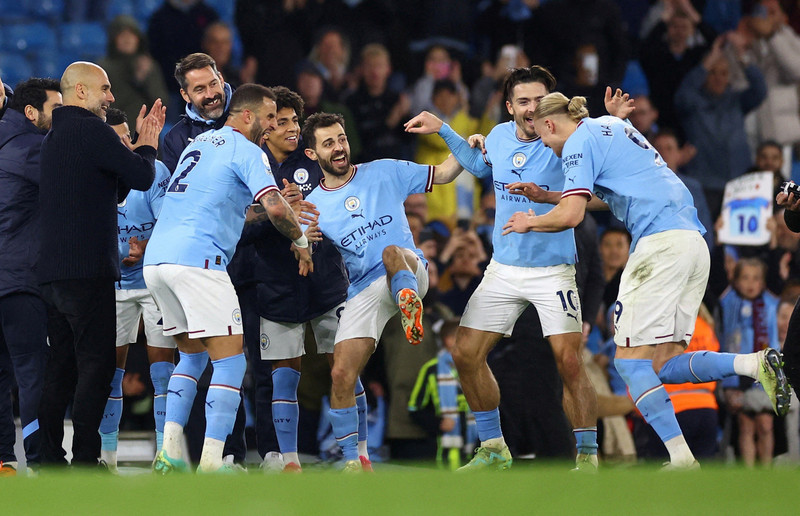 Manchester City's Erling Braut Haaland receives a guard of honour from teammates and manager Pep Guardiola at the end of the match after breaking the record for most goals scored in a single Premier League season - Premier League - Manchester City v West Ham United - Etihad Stadium, Manchester, the UK - May 3, 2023. (Photo: Reuters) 