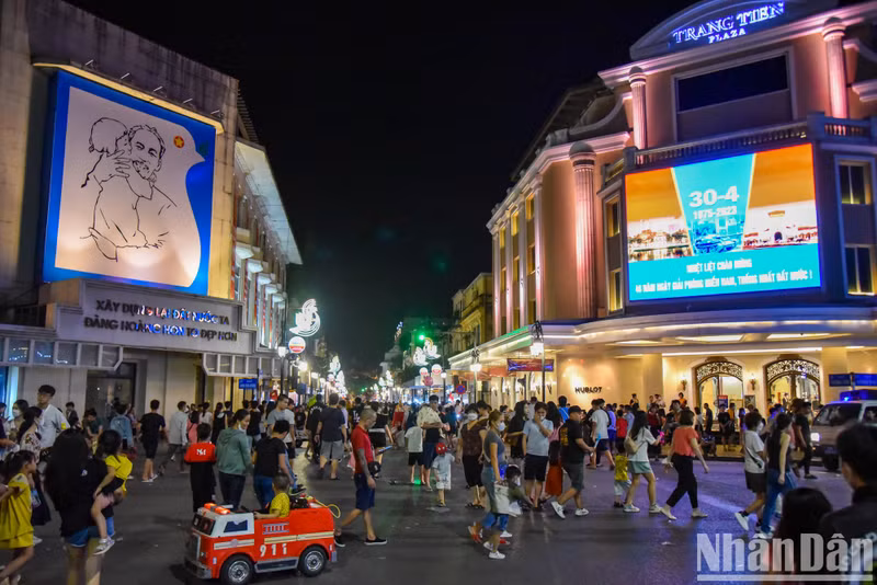 The area surrounding Hoan Kiem Lake packed with both domestic and foreign tourists.