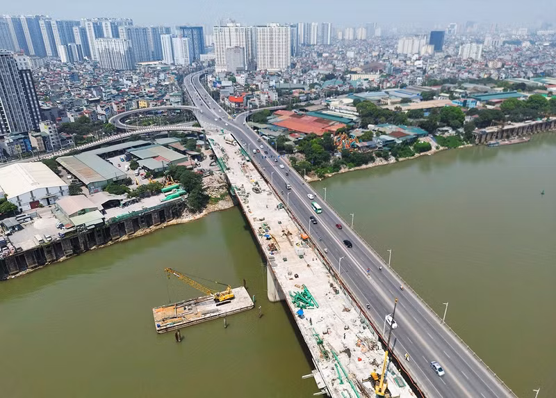 According to the Hanoi transport project management board, contractors are aiming to complete all the remaining work in August so that the bridge can open to traffic on September 2. According to the Hanoi transport project management board, contractors are aiming to complete all the remaining work in August so that the bridge can open to traffic on September 2.