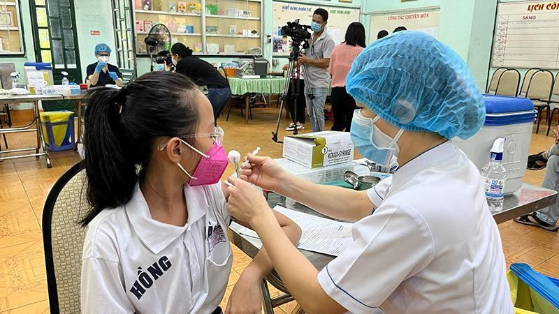 A child is vaccinated against COVID-19.