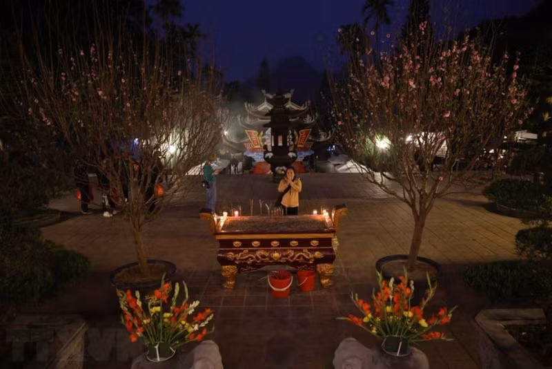 Pilgrims and visitors offer incense ahead of the formal opening of the festival.