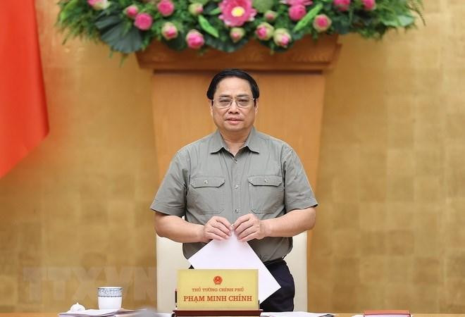 Prime Minister Pham Minh Chinh speaks at the meeting. (Photo: VNA)