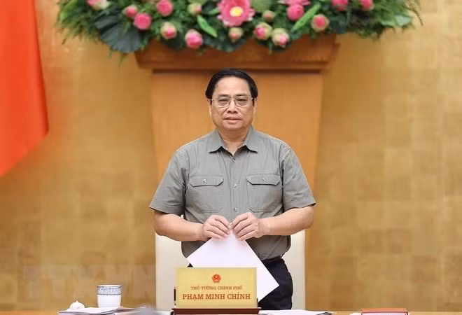 Prime Minister Pham Minh Chinh speaks at the meeting. (Photo: VNA)