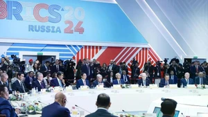 Prime Minister Pham Minh Chinh (fifth from left) attends and delivers a speech at the the plenary session of the expanded BRICS Summit in Kazan, Russia, in October 2024. (Photo: VNA) 