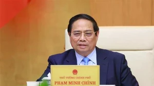 PM Pham Minh Chinh speaks at the meeting. (Photo: VNA)