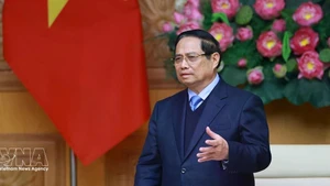 Prime Minister Pham Minh Chinh speaks at a meeting with a delegation of leaders from 37 member companies of the Japan Chamber of Commerce and Industry. (Photo: VNA)