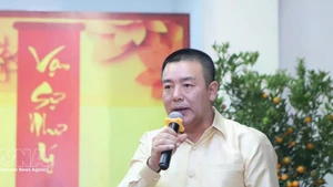 Defence Attaché of Viet Nam to Laos Colonel Phan Huu Thang speaks at the event. (Photo: VNA)