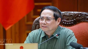 Prime Minister Pham Minh Chinh speaks at the meeting between standing Government members and representatives of ministries, agencies and Phu Tho province (Photo: VNA)